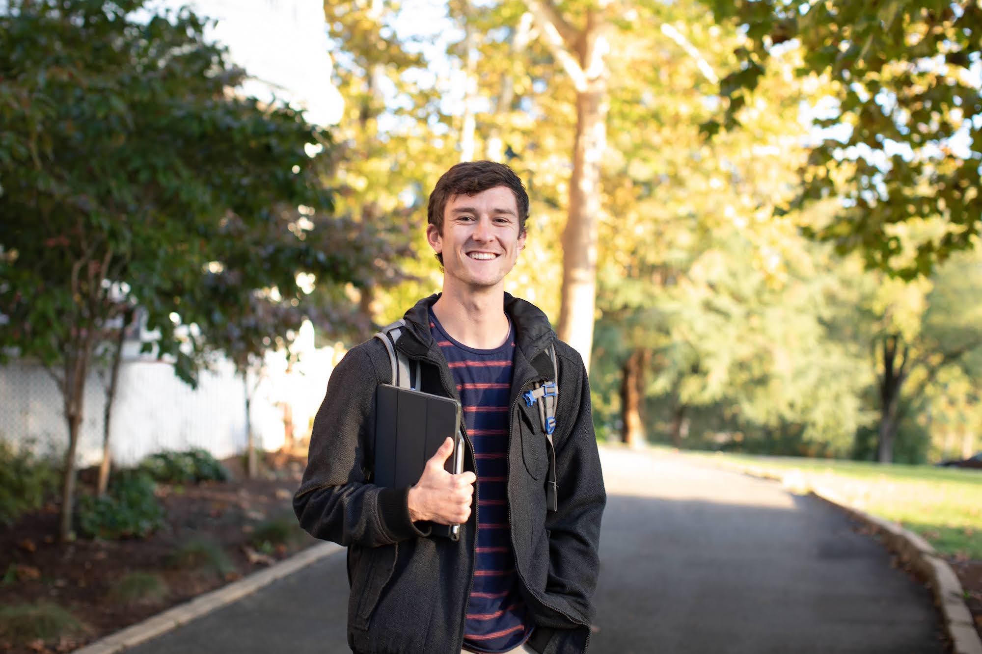 Student standing on front walk