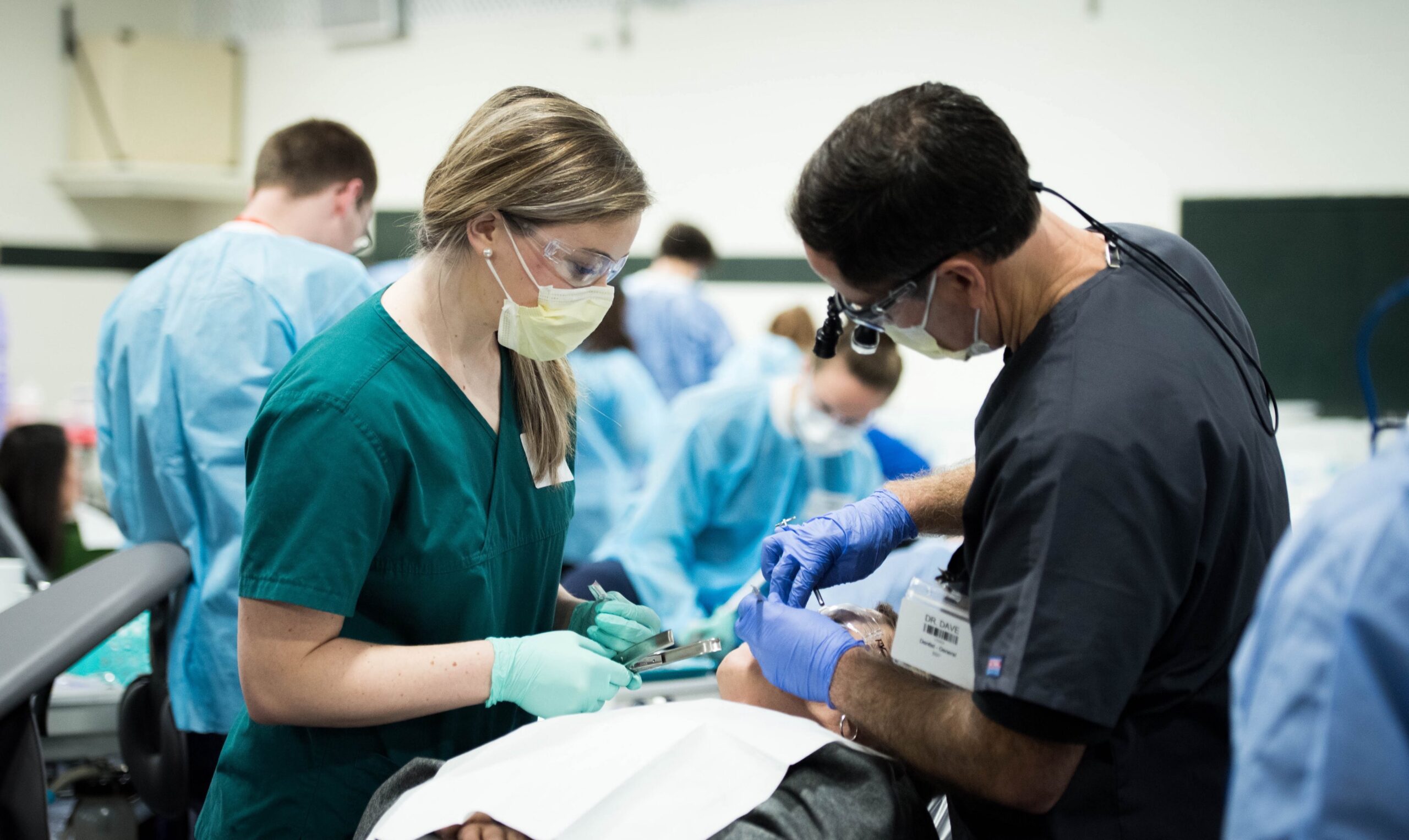 Doctors standing over patient