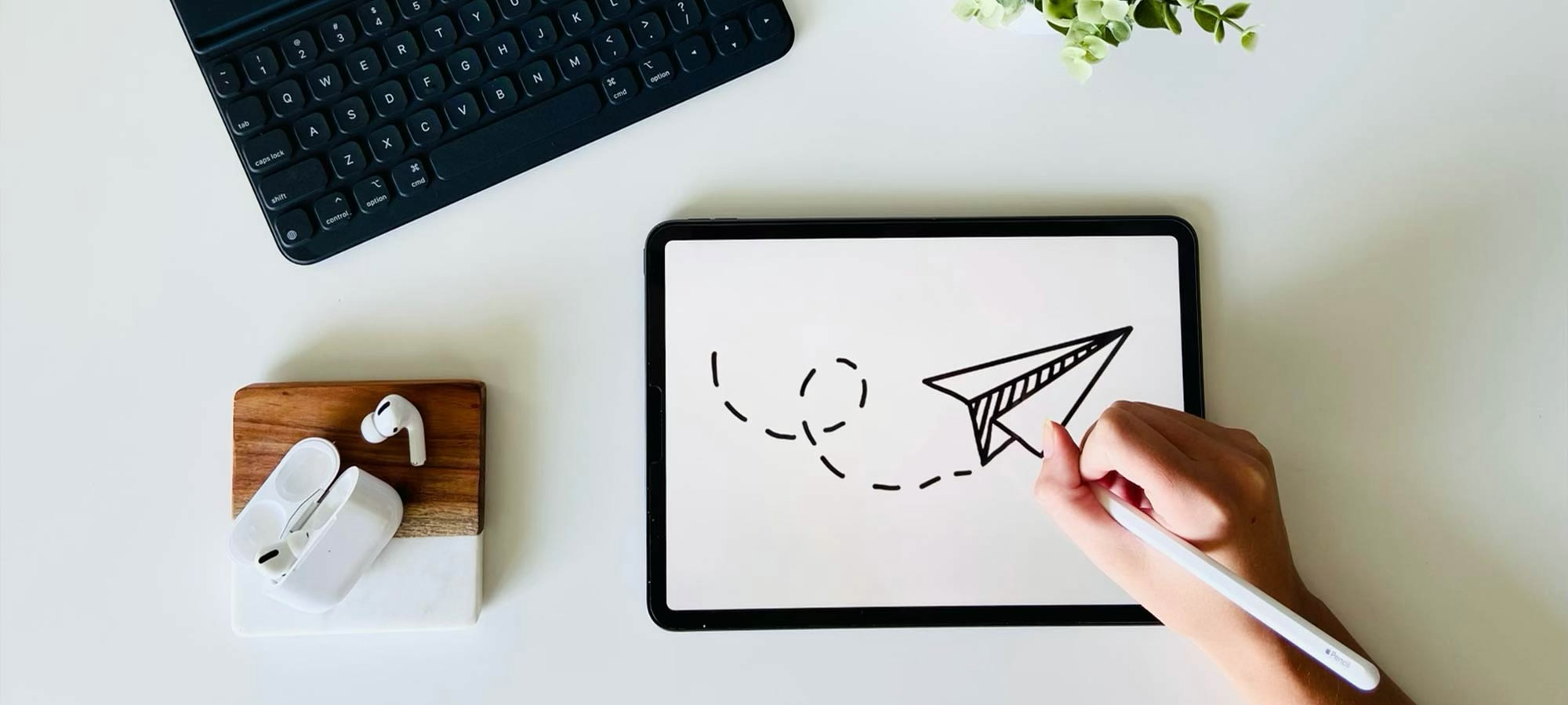 Image of an ipad and airpods