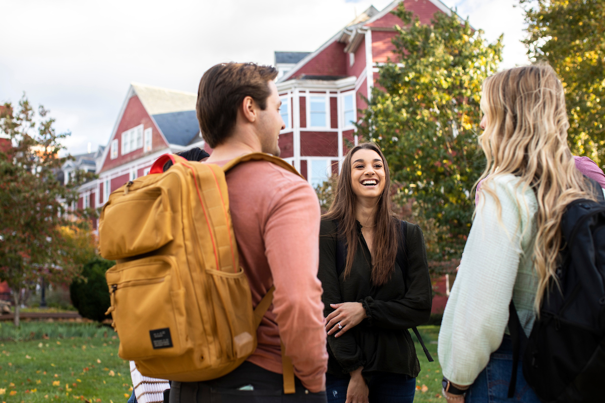 Students talking outside of Main Hall.