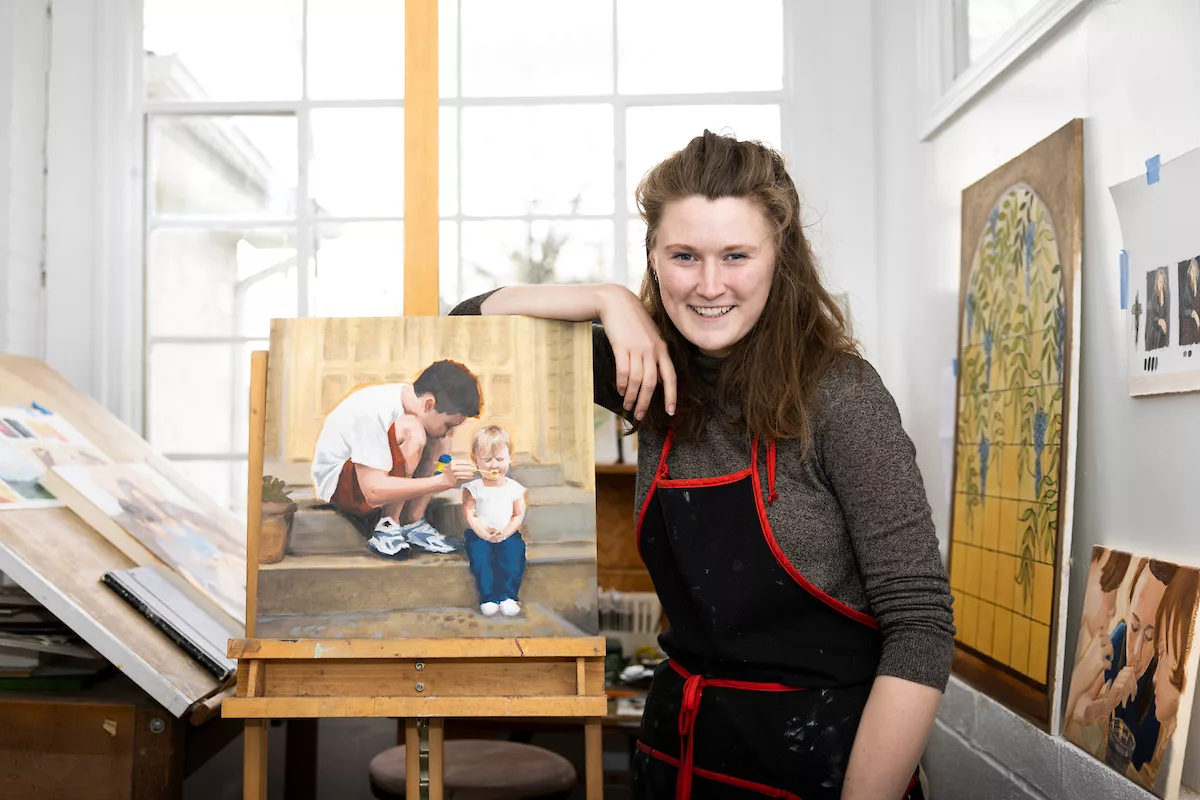 Student with oil painting
