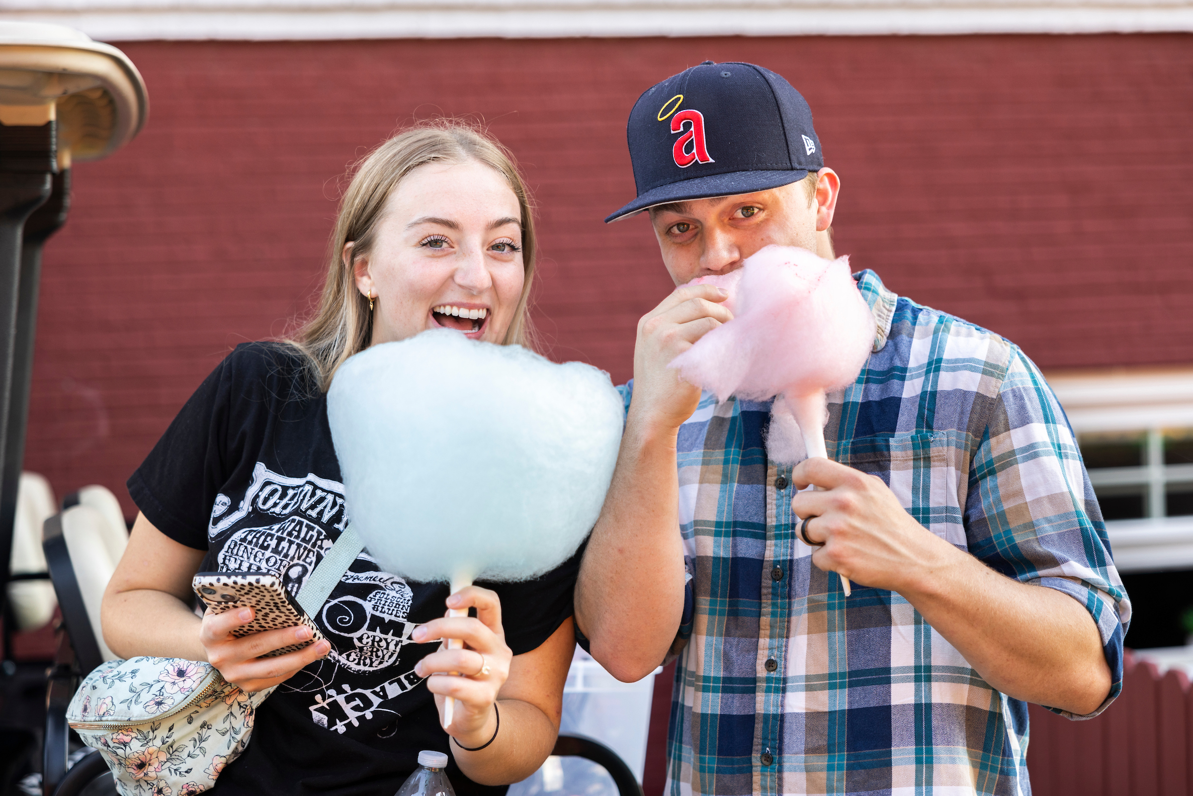 Two students eating cotton candy