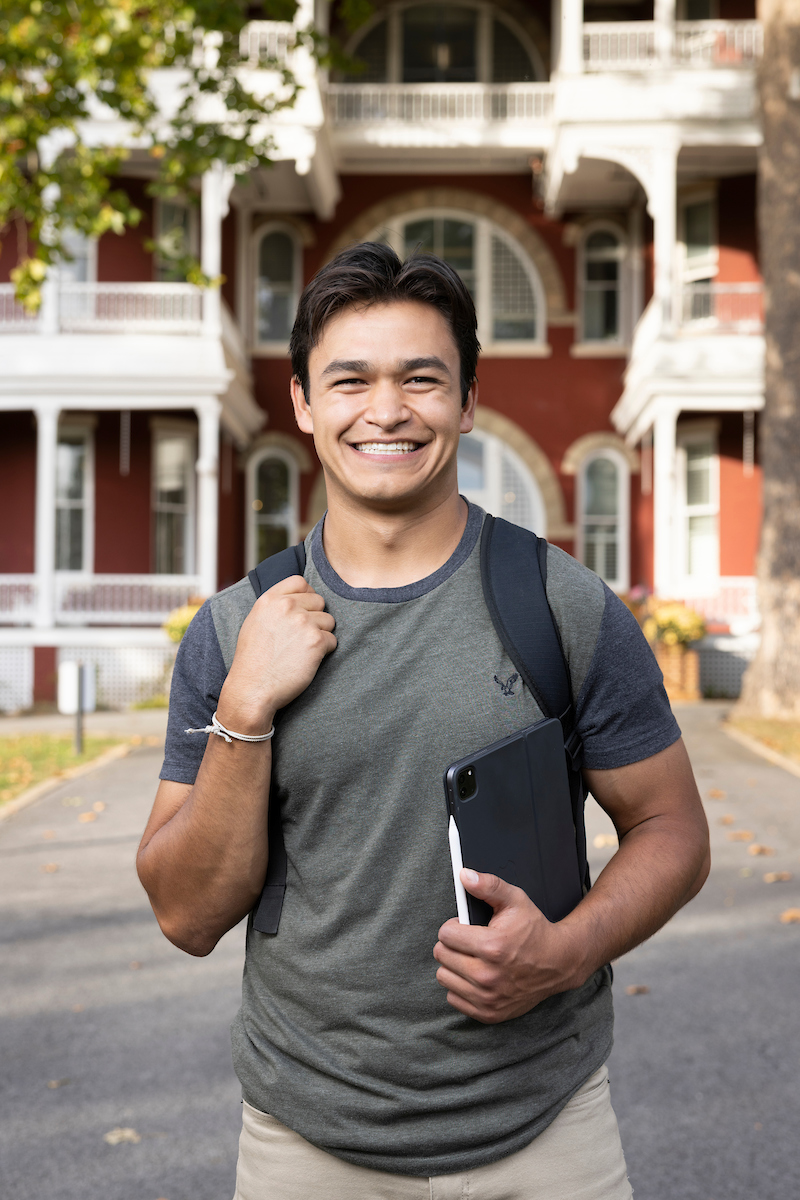 Smiling student with iPad.