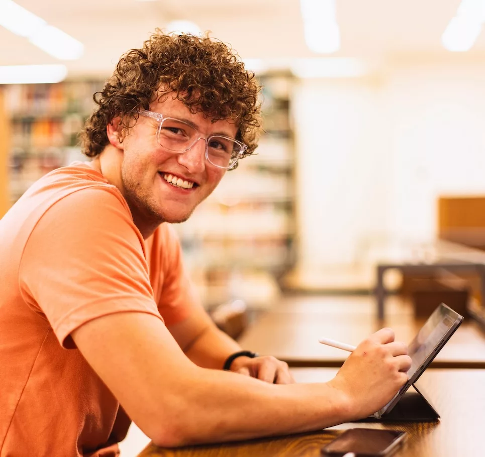 Student studying in library.