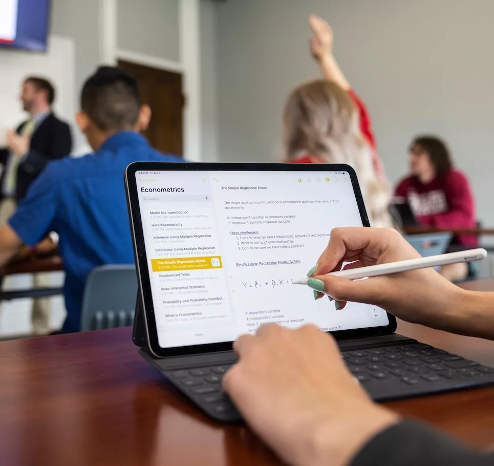 Student learning economics in class.