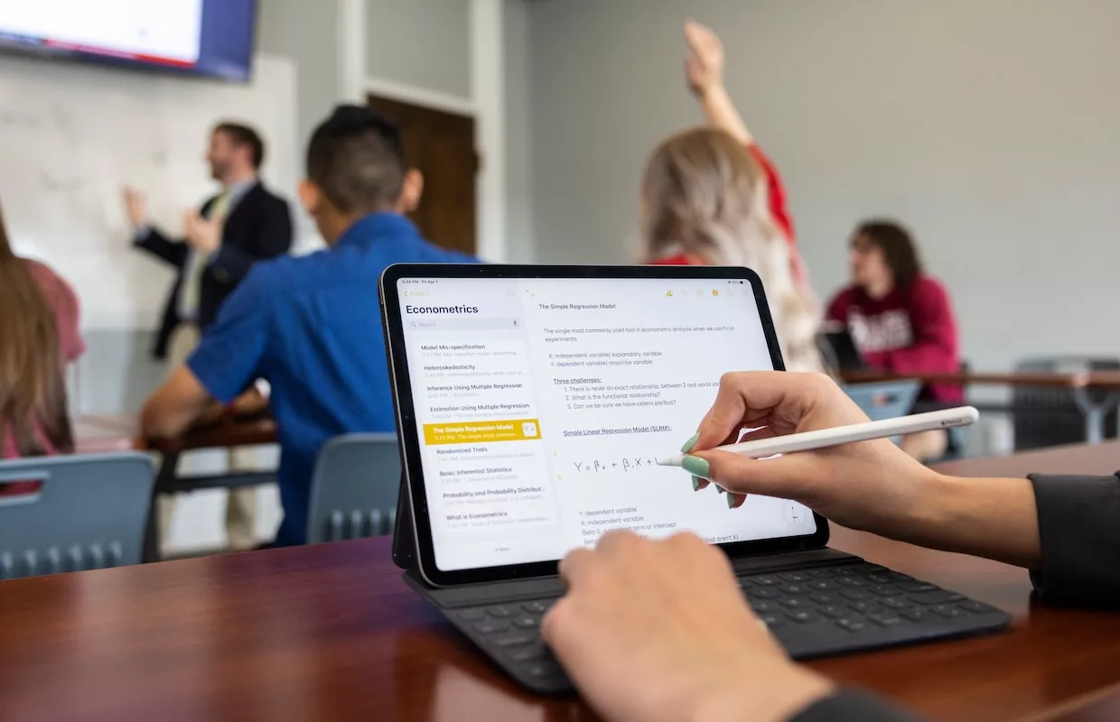 Student learning economics in class.