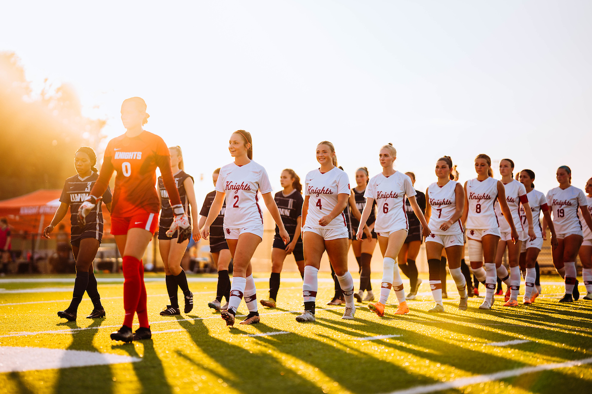 Women's Soccer Team walking on the field