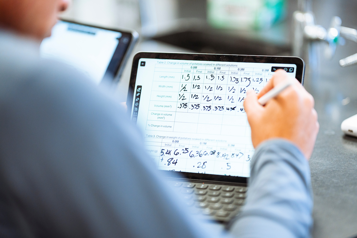 Student doing biochemistry homework on iPad