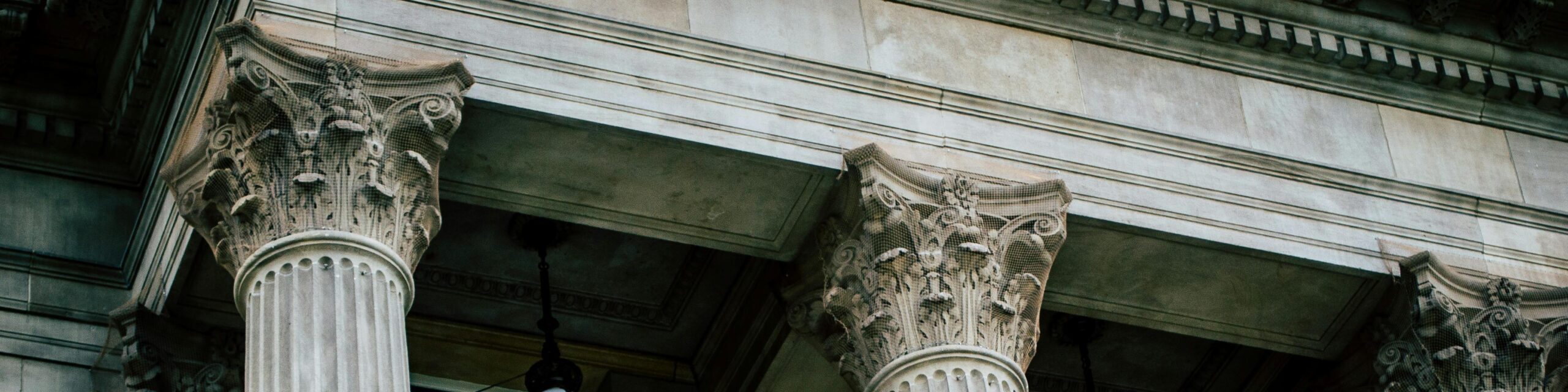 Grey Concrete Building With Classical-Style Columns